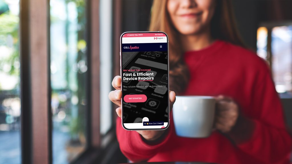 woman holding up her phone with cell medics homepage on the screen