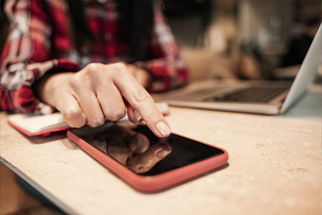 Person touching their new screen protector