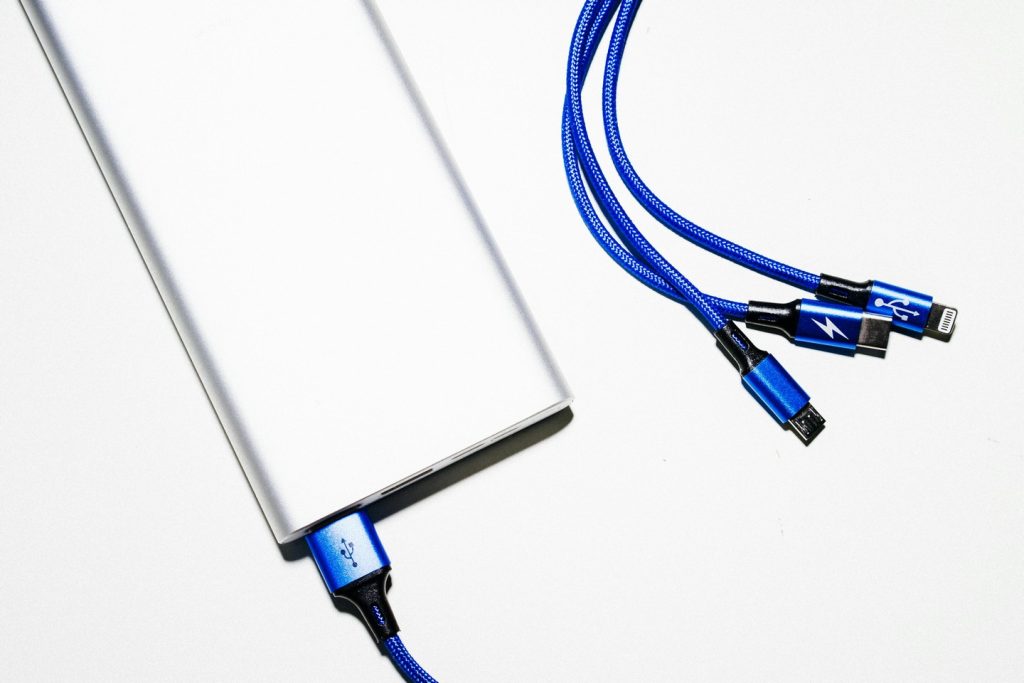 blue power cable plugged into a power bank style battery