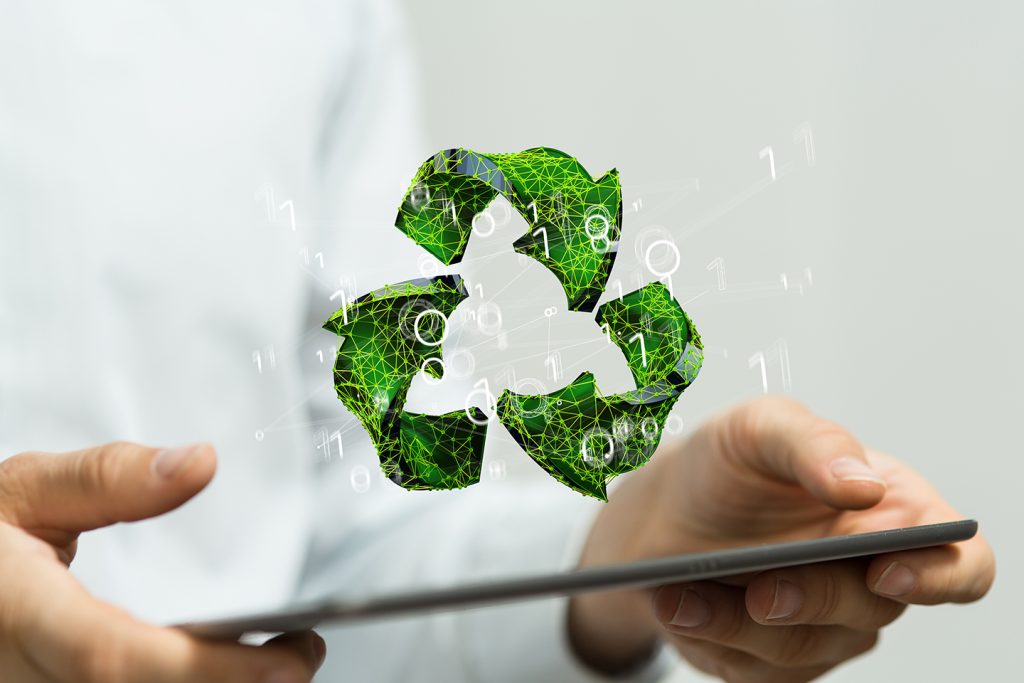 man holding a tablet with a recycle icon